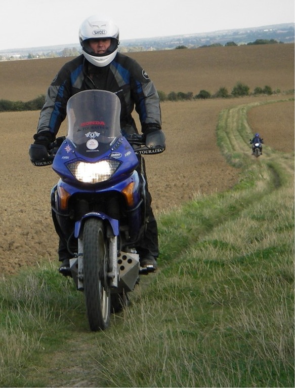 A field road, 2 riders